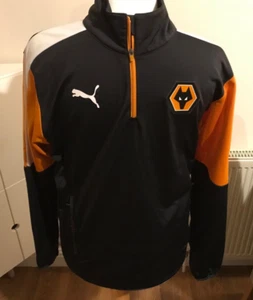WOLVES FOOTBALL PUMA1/4 CREMALLERA JERSEY CAPA BASE UK M NEGRO/NARANJA - Imagen 1 de 9