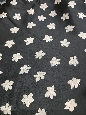 Hi-Fashion Fabrics Crepe Sheer Black W/ White Leaves 32" By 60" Remnant  - Image 1 of 3