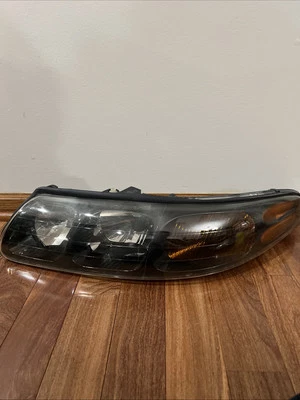 05 Faro Pontiac Bonneville algo nublado Sle y Gxp LH lado del conductor Foto 1 de 4