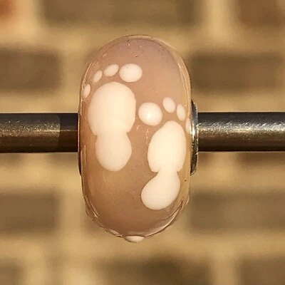 Authentic genuine trollbeads OOAK unique glass bead white footprint beige base - Image 1 of 3