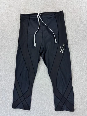 Pantalones deportivos de compresión CW-X de 3/4 de longitud (grandes para mujer) negros Foto 1 de 4