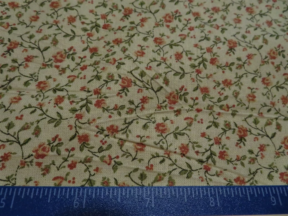 Molas de tecido de algodão bronzeado com pequenas folhas laranja e verde  - Imagem 1 de 1