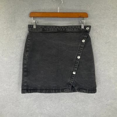 Minifalda vaquera Free People talla 10 negra con botones asimétricos frontales festival Foto 1 de 4