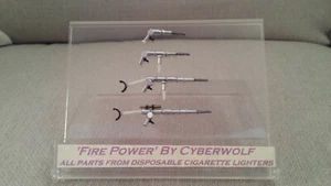 MODERN ART : SCI-FI WEAPONS/GUNS IN CASE MADE ONLY FROM CIGARETTE LIGHTER PARTS - Picture 1 of 12