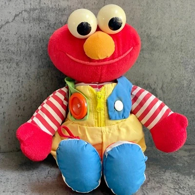 Juguete sensorial de aprendizaje para bebé de colección SESAME STREET ELMO Dress Me Up 1993 Tyco Foto 1 de 4