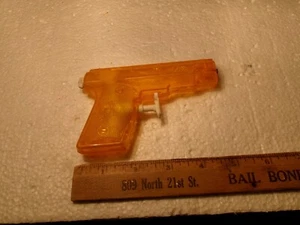 VINTAGE 250 REPEATER WATER SQUIRT GUN PISTOL ORANGE TRANSLUCENT PARK PLASTICS - Picture 1 of 4