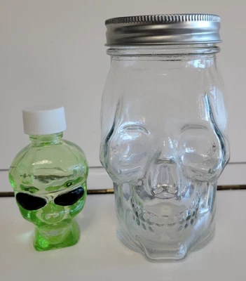 CLEAR AND LIME GREEN SKULL DESIGN BOTTLES JARS WITH METAL AND PLASTIC LIDS - Image 1 of 4
