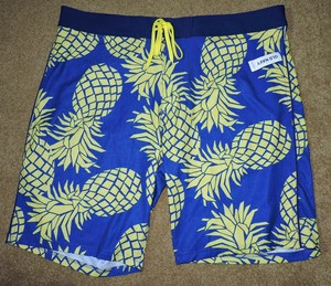 gold hibiscus print swim shorts
