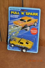 NIP Vintage CIBA 1963 Yellow Corvette 4" Pull 'N' Spark Rocking Engine