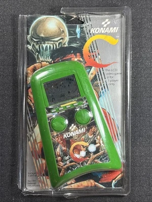 CONTRA portátil Konami 1989 juego electrónico LCD Tiger RARO SELLADO Foto 1 de 4