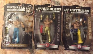 JAKKS PACIFIC WWE RUTHLESS AGGRESSION REY MYSTERIO LOT (3) SERIES 35,39,& 41 MIP - Picture 1 of 7