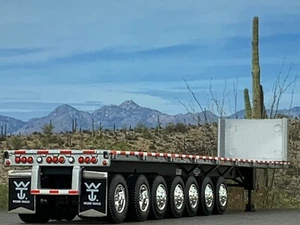 1/64 DCP SILVER 53' WILSON ROAD BRUTE 7 AXLE FLATBED TRAILER W/ BULKHEAD - Picture 1 of 6