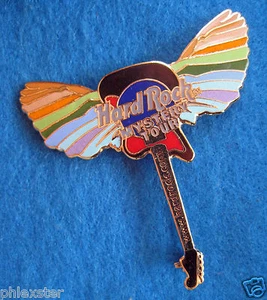 ONLINE WEBSITE MYSTERY TOUR MULTI COLOURED WINGS GUITAR Hard Rock Cafe PIN - Picture 1 of 1