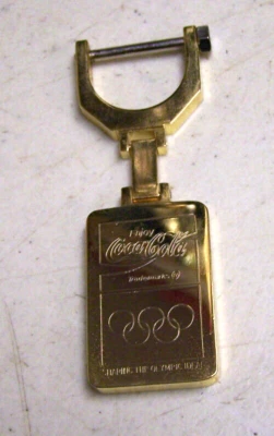 Vintage Brass Coca Cola 1996 Olympic Gold Keychain - Image 1 of 4