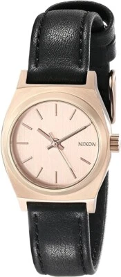 Reloj Nixon para mujer pequeño Time Teller tono dorado con correa de cuero negro Foto 1 de 4