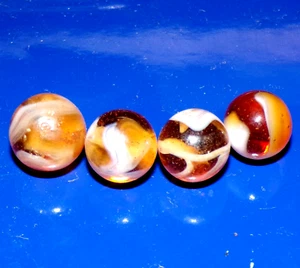 Lote de cuatro canicas de vidrio ámbar transparente remolino blanco - 24/11 - Imagen 1 de 4