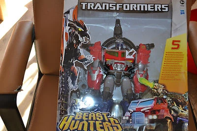 transformers neuf optimus prime canons tournoyants chasseur de créatures  - Photo 1/2