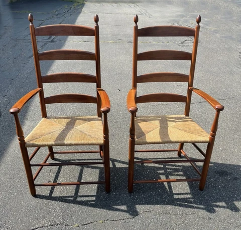 Pr artisan of bench made Shaker style cherry arm chairs with rush seats c 1990 Cover