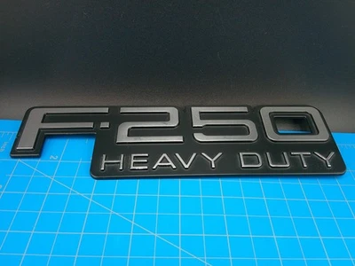 Ford F-250 Heavy Duty Emblem Badge OEM F7TB-16B114-BA Genuine 1997-1999 - Image 1 of 4