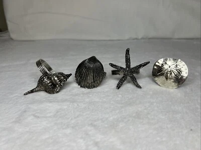Juego de 4 servilletas de metal cepillado conchas de playa náuticas Coastal Hardware Foto 1 de 4