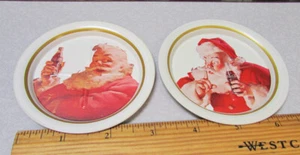 1983 Ohio Art set of 2 metal Coca cola Santa Claus Scene metal coasters NOS VTG - Picture 1 of 4