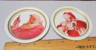 1983 Ohio Art set of 2 metal Coca cola Santa Claus Scene metal coasters NOS VTG - Image 1 of 4