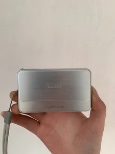Sony Cybershot Digital Camera DSC-T99 Silver 14.1MP W/ Charger, Battery & Memory - Picture 1 of 4