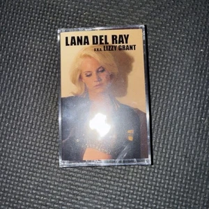 Lana Del Ray A.K.A. Lizzy Grant Red Clear Cassette Tape 5 Points Records 2023 - Picture 1 of 11