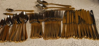 UNUSED UNBRANDED 65 PC. STAINLESS STEEL FLATWARE SET. SILVER/GOLD COLORED TRIM - Image 1 of 4