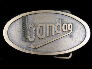 SF11155 *NOS* VINTAGE 1970s **BANDAG** TIRE COMPANY ADVERTISEMENT BELT BUCKLE - Picture 1 of 2