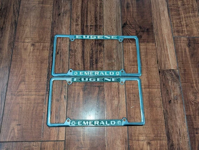 2 пары РЕДКИХ металлических рам для номерного знака Eugene Oregon Emerald Chrysler Plymouth - Изображение 1 из 2