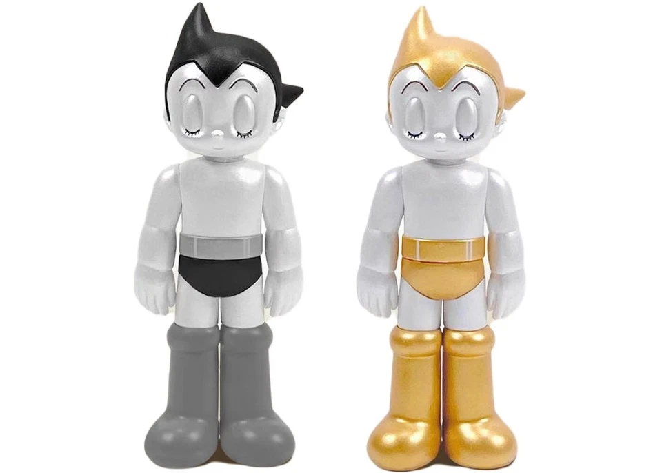 Juego de figuras de vinilo Astro Boy PVC ojos cerrados oro y plata 5,35" de Toyqube 2 piezas Foto 1 de 1