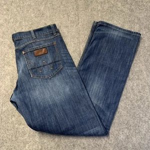 Pantalones de mezclilla retro Wrangler para hombre ajustados rectos 38x36 azul medio lavado oscuro - Imagen 1 de 19