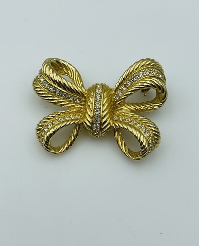 Christian Dior spilla fiocco strass trasparenti placcata oro vintage