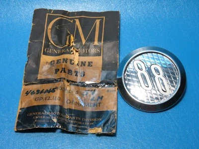 NOS GM 1954 Oldsmobile Super 88 LH Rear Quarter Door Medallion Ornament 4636065 - Image 1 of 4