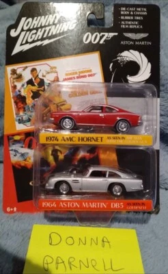 NOVO! JOHNNY LIGHTNING JL 1:64 PACOTE COM 2 007 1974 AMC HORNET & '64 ASTON MARTIN DB5 - Imagem 1 de 4