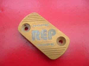 AJP TRIALS BIKE BRAKE / CLUTCH LARGE MASTER CYLINDER COVER GOLD, HOPE REP - Picture 1 of 1