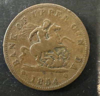 1854 BANK OF UPPER CANADA ONE PENNY TOKEN "C&N$DA" - Image 1 of 2