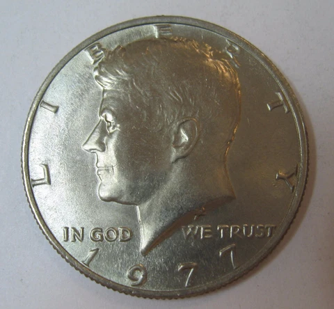 1977 John F Kennedy Clad Half Dollar In Choice BU Condition From Mint Set Cover