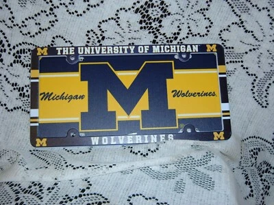 MICHIGAN WOLVERINES  PLASTIC LICENSE PLATE TAG AND FRAME DEAL 6" X 12" NEW  - Image 1 of 3