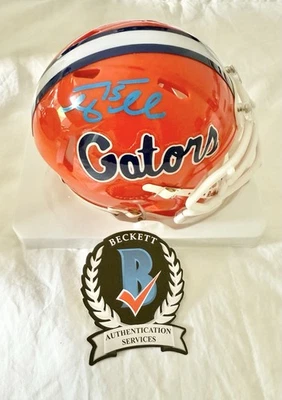 UNIVERSITY OF FLORIDA GATORS TIM TEBOW signed RIDDELL MINI HELMET BECKETT BAS - Image 1 of 4