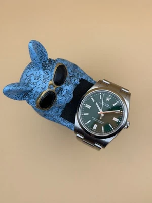 Rolex Oyster Perpetual 126000 Pulsera Oyster Verde con Bisel de Plata Foto 1 de 4