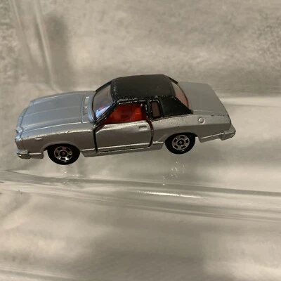 Ford Mustang II GHIA F38 1978 Tomica Tomy 1/63 plateado con interior rojo Japón S1 Foto 1 de 4