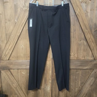 Брюки Marks & Spencer стандартного покроя из шерстяной смеси 38x33 черные плоские спереди - Изображение 1 из 4