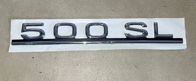 Emblema modelo tampa traseira Mercedes-Benz 500SL- 107-817-15-15 - Para 500SL - Imagem 1 de 4