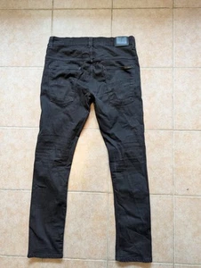 Pantalones de mezclilla ajustados elásticos NUDIE para hombre TAPE TED ORGBLACK talla 34. (36) - Imagen 1 de 8