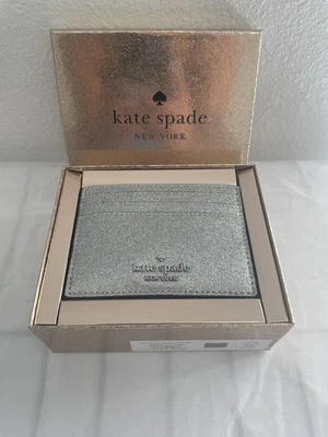 Cartera Kate Spade Glimmer en caja pequeña delgada tarjetera plateada KE448 NUEVA CON ETIQUETAS PRECIO DE VENTA SUGERIDO POR EL FABRICANTE 99 $ Foto 1 de 4