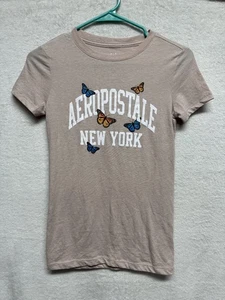Camiseta Aeropostale New York Niñas Beige Mariposa XS - Imagen 1 de 7