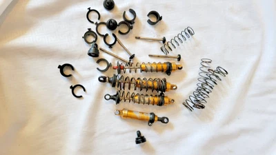 Vintage RC Monster Kyosho gold shocks Front and rear shock parts set - Image 1 of 4