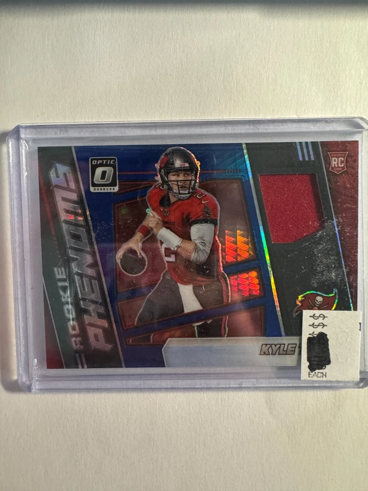 K221,743 - 2021 Donruss Optic Rookie Phenoms Jerseys Blue Hyper #9 Kyle Trask - Image 1 of 1